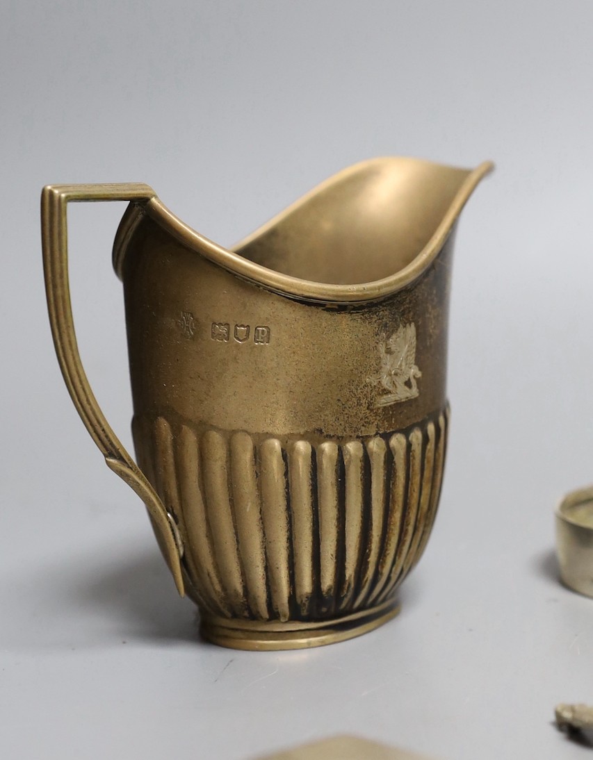 Assorted silver including a Victorian bullet shaped teapot, Arthur Sibley, London, 1878, height 12.1cm, sauceboat, cream jug, sugar bowl, cup, tea strainer, watch holder, match sleeve, pair of ashtrays, lighter, three na